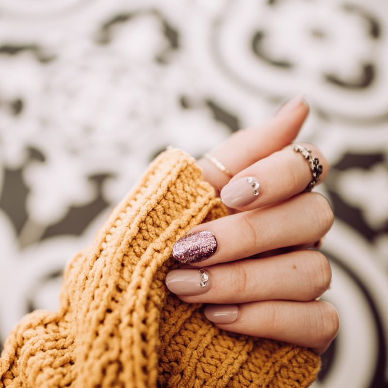 person wearing silver diamond ring