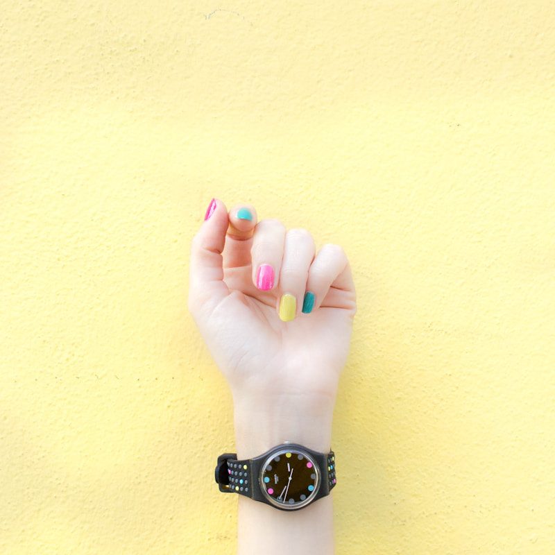 person wearing round black analog watch at 9:46