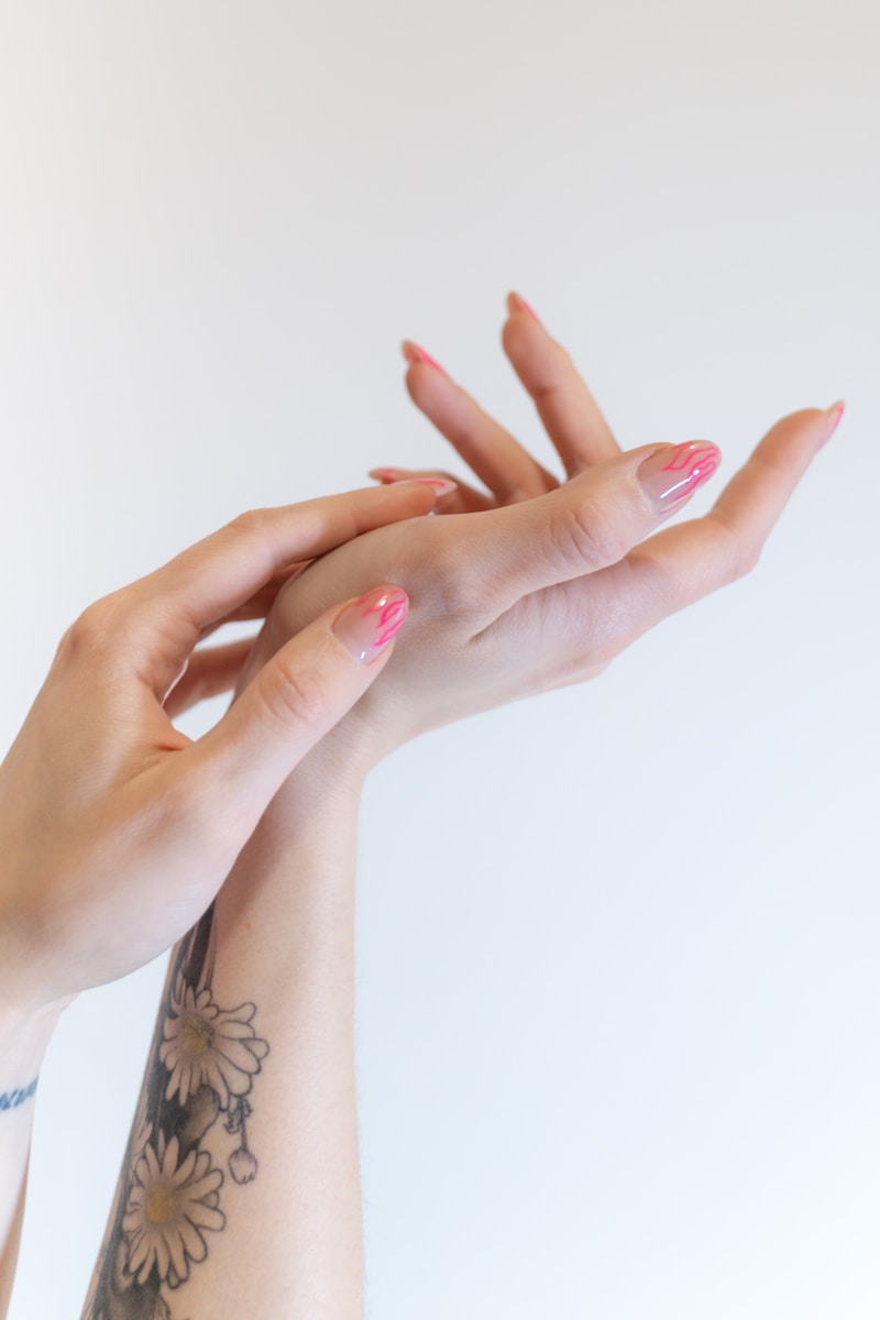 two hands reaching up towards each other