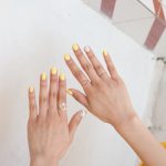 person wearing silver diamond ring